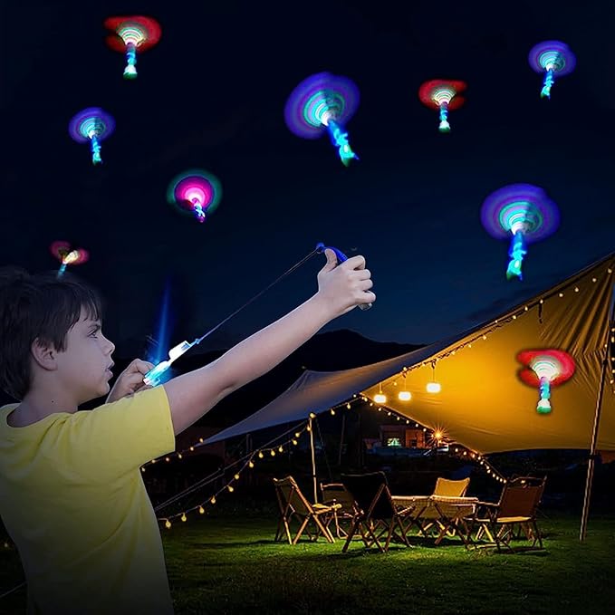 50 Pcs Slingshot Flying Toys with Led Lights,25 Pcs LED Arrow Helicopters + 25 Pcs Launchers,Summer Outdoor Game Glow in The Dark Party Supplies Party Favors for Kids 4-8,8-12 Bulk Toys